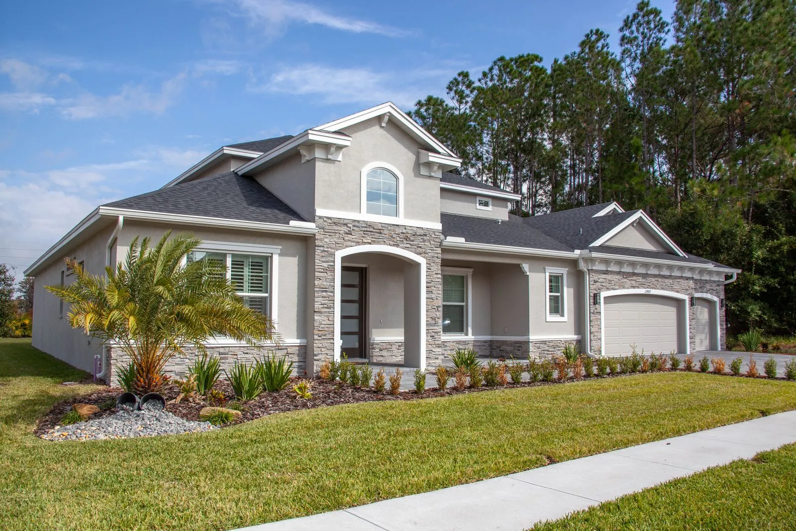 A two-story suburban house on a sunny day